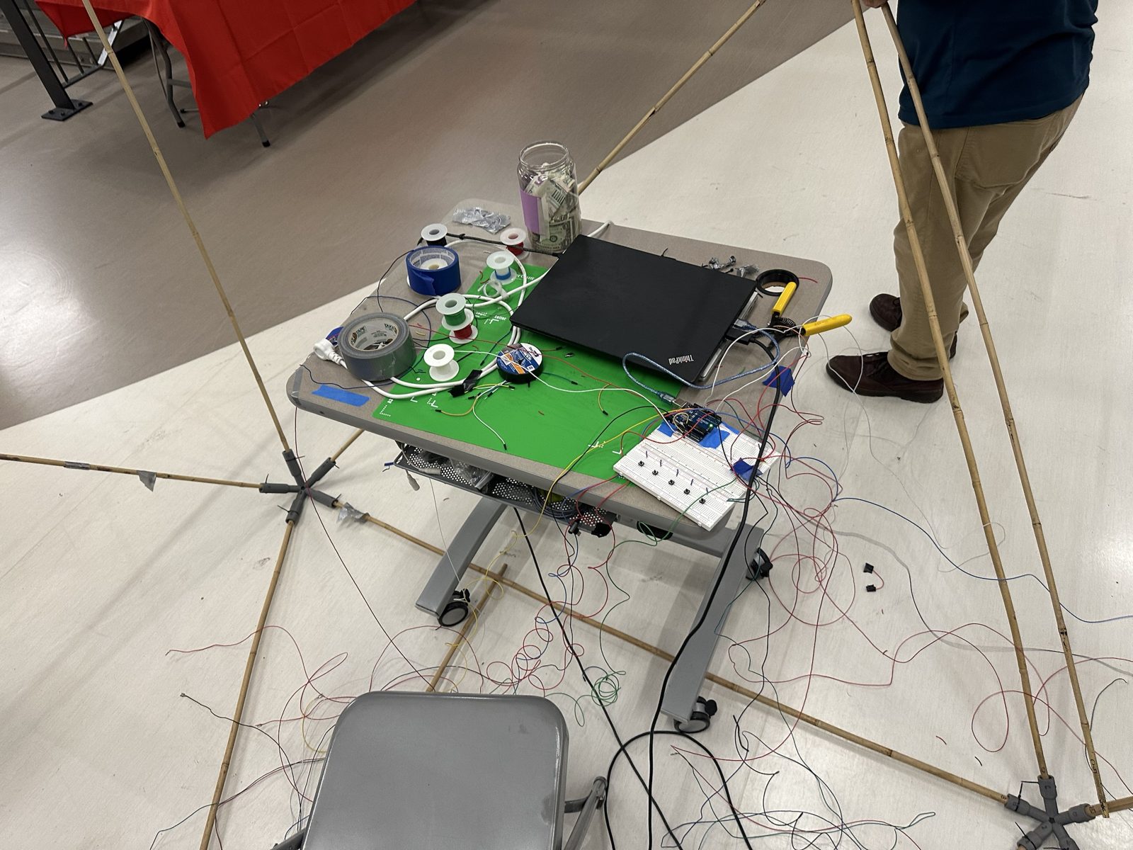 The control table at the open house, with a laptop, Arduino, breadboard and many wires